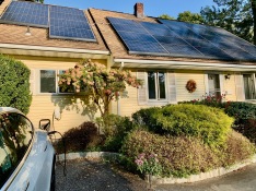 Solar panels and electric vehicle, New York, USA
